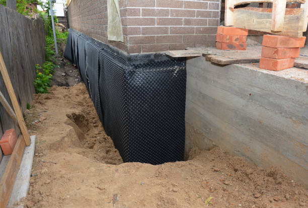 Happy homeowners after waterproofing job in Herndon